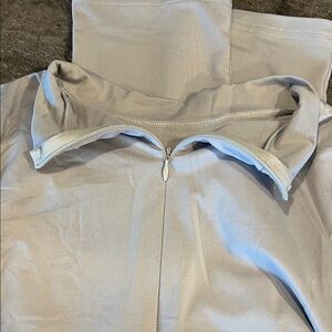 Light Beige Zip-Up Top with High Collar